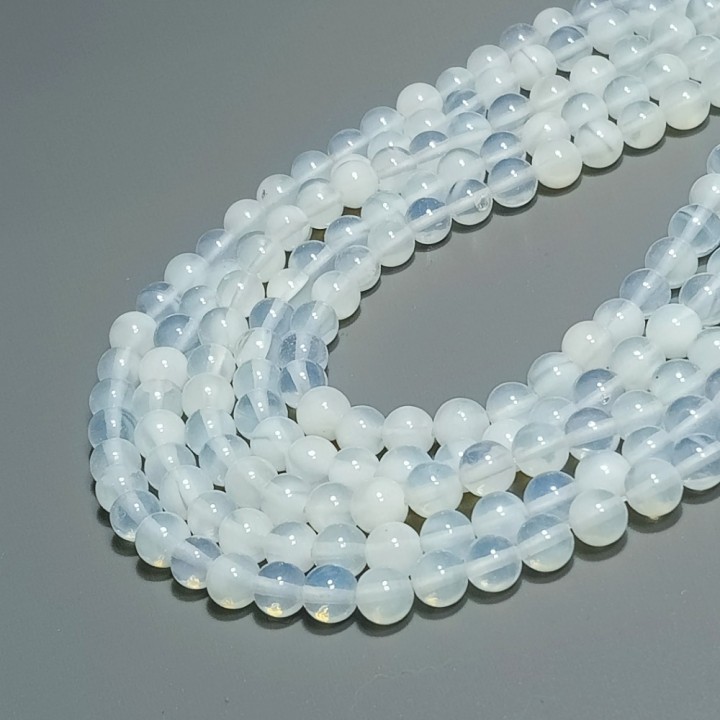 Бусины из лунного камня (искусственный камень), диаметр 6-6.5мм, 59шт в нити.
